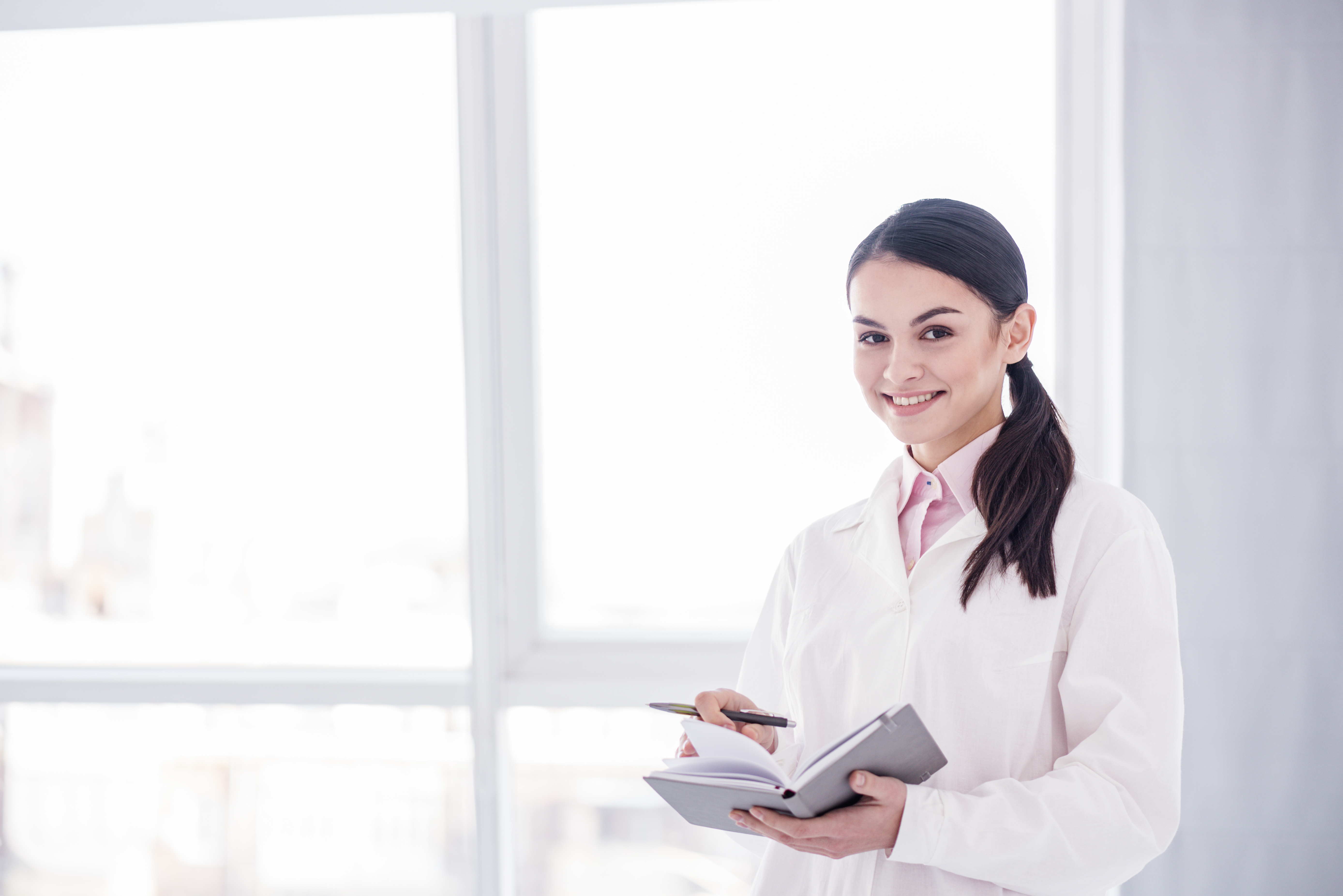 Doctor holding her notebook