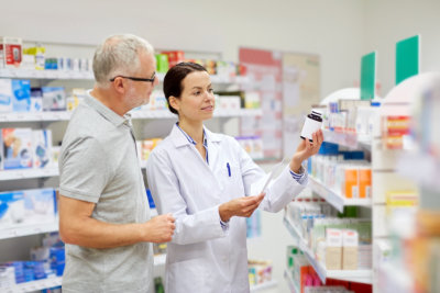 pharmacist assisting an elderly man