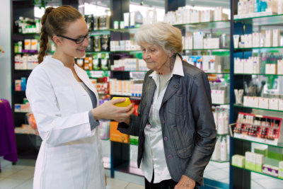 pharmacist looking at a prescription